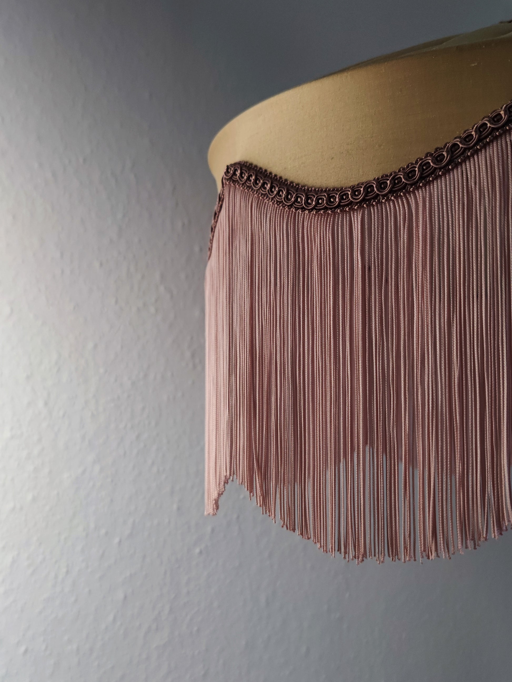 Gold silk fringed lampshade with blush fringe and decorative trim, ideal for Art Deco-inspired luxury lighting in elegant home interiors.