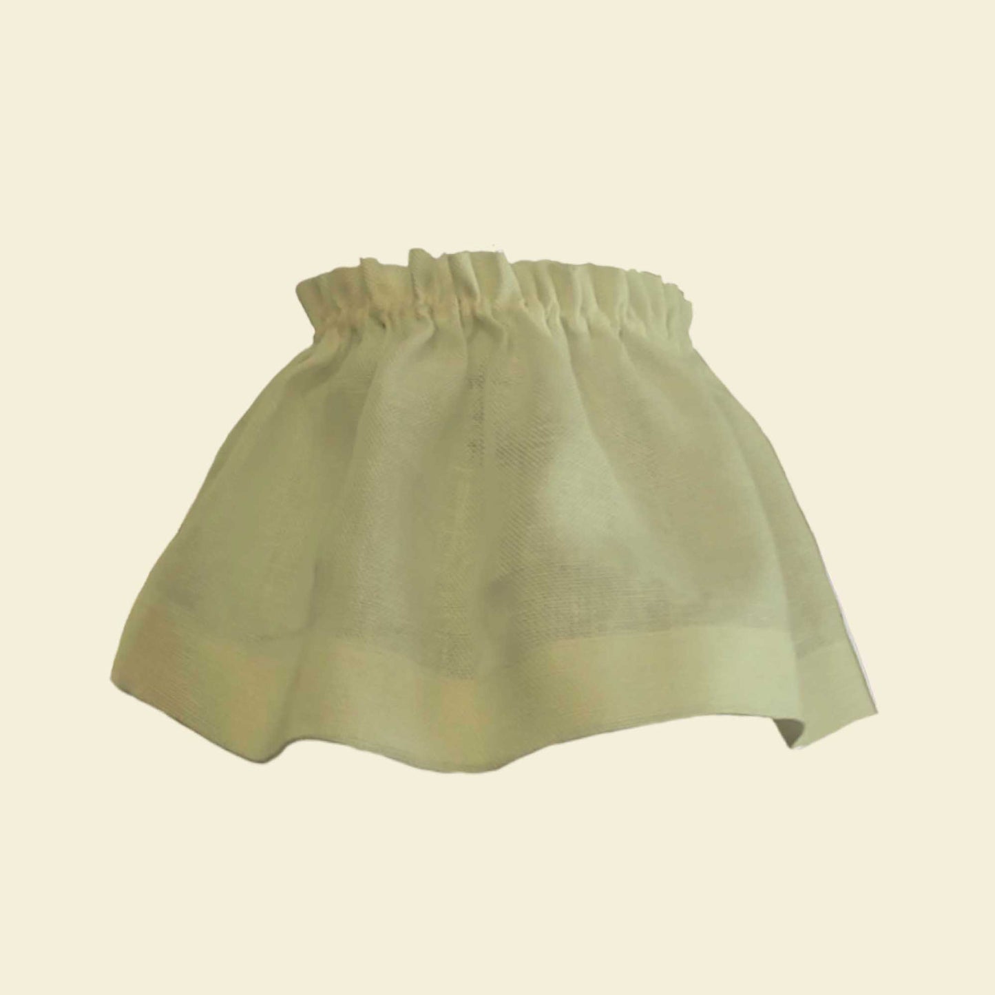 Light green skirt on a beige background