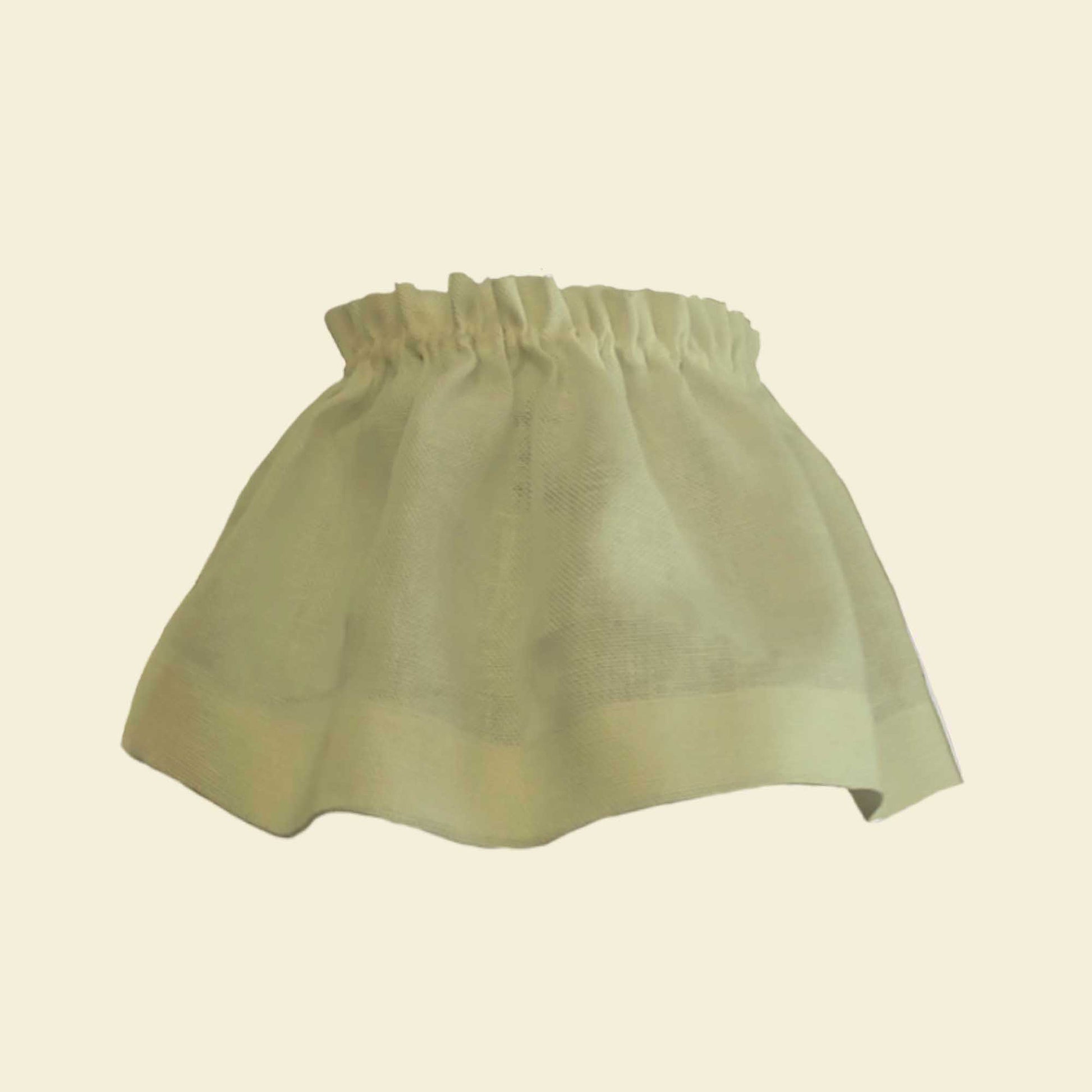 Light green skirt on a beige background