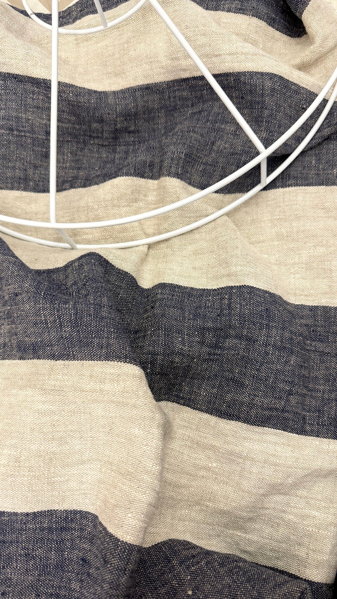 Close-up of a striped fabric with black and beige colors.