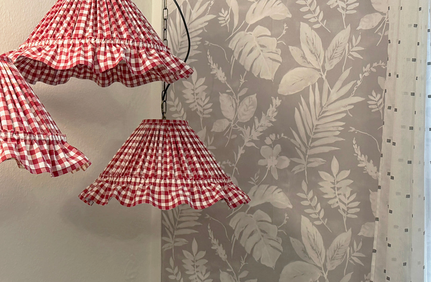 Rustic gingham lampshade with ruffles in red cotton fabric, ideal for cottage core or farmhouse lighting decor in home interiors.