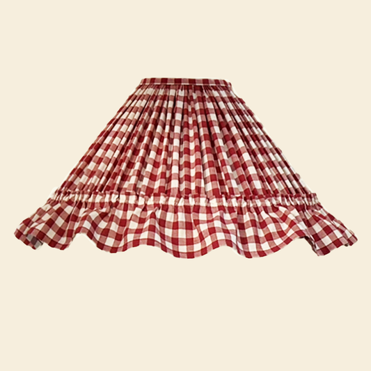 Red and white checkered skirt lampshade on a beige background